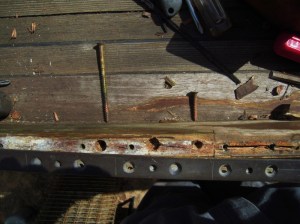 The toe rail is fastened to the covering board with 4" silicon bronze screws.  The phillips heads want to strip out if you even look at them the wrong way.