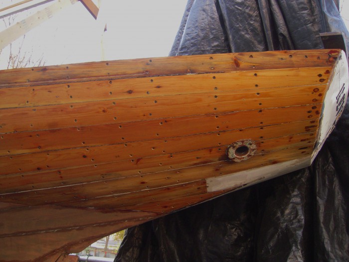 Reverie's lovely overhang. The one small plank is a former repair made of dissimilar wood and will most likely be replaced. 